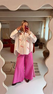 Pinky roze broek met witte streep